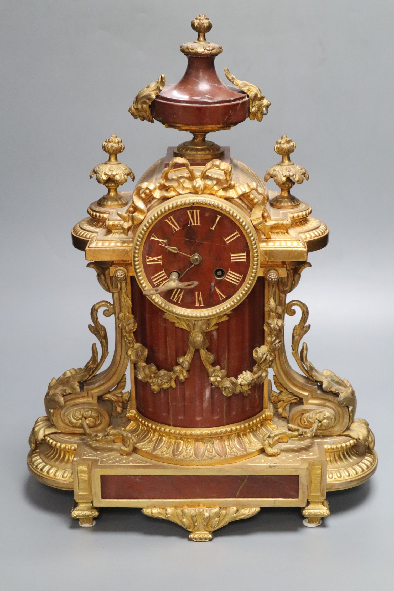 A French rouge marble and ormolu mantel clock, height 46cm